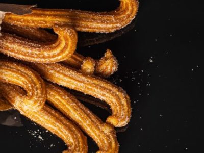 Yellow Whinnie Churros Logo